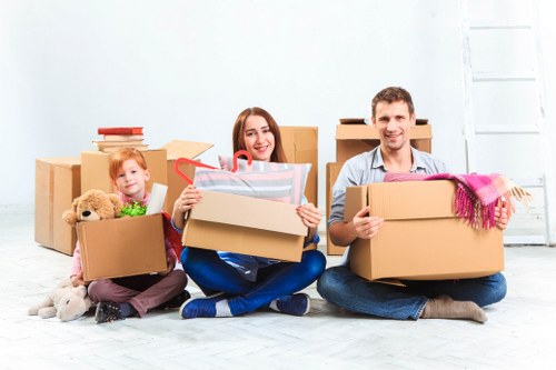 Household boxes and furniture being loaded for removal truck hire
