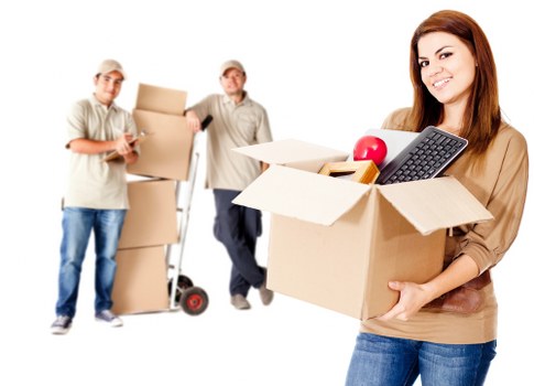 Eco-friendly moving with cardboard, donation items, and low-emission transport