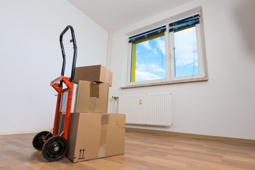 Furniture and boxes being loaded into a moving van for a St Helier move