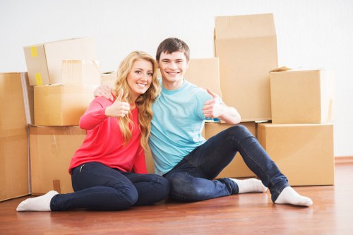 Local removals team handling boxes and furniture in St Helier