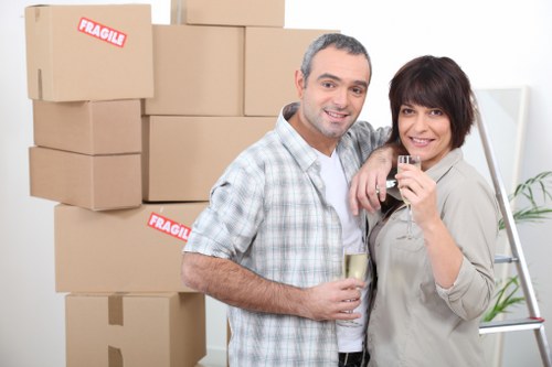 Professional movers handling furniture loading for a St Helier relocation