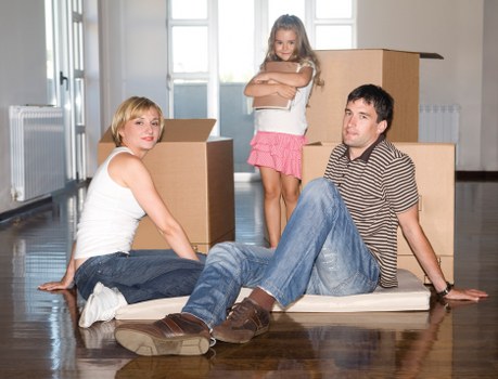 Careful wrapping of fragile household items during a move